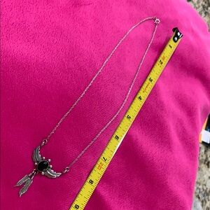 Stylish Sterling Silver Necklace with Black Stone and Feather Accents